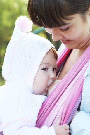 8094358 - walk with the child in a baby sling. breastfeeding